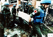 UN Peace keepers collecting bodies